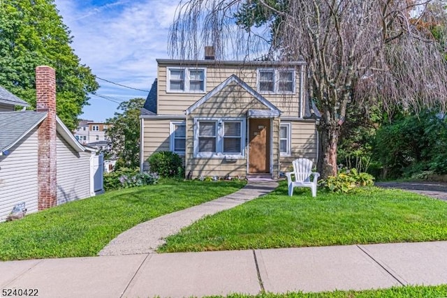 315 Green St, Boonton Town, NJ 07005 - view of front of house featuring a front yard and a chimney