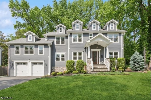 2335 Longfellow Ave, Scotch Plains Twp, NJ 07076 - view of front of house featuring driveway, a front yard, an attached garage, and stone siding