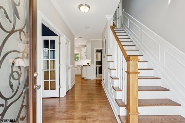 2335 Longfellow Ave, Scotch Plains Twp, NJ 07076 - entryway with wood finished floors, stairs, ornamental molding, and a decorative wall