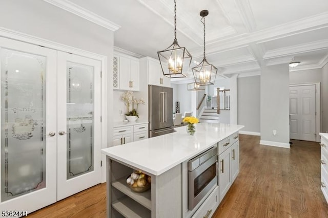 2335 Longfellow Ave, Scotch Plains Twp, NJ 07076 - kitchen with appliances with stainless steel finishes, white cabinets, coffered ceiling, light countertops, and a center island