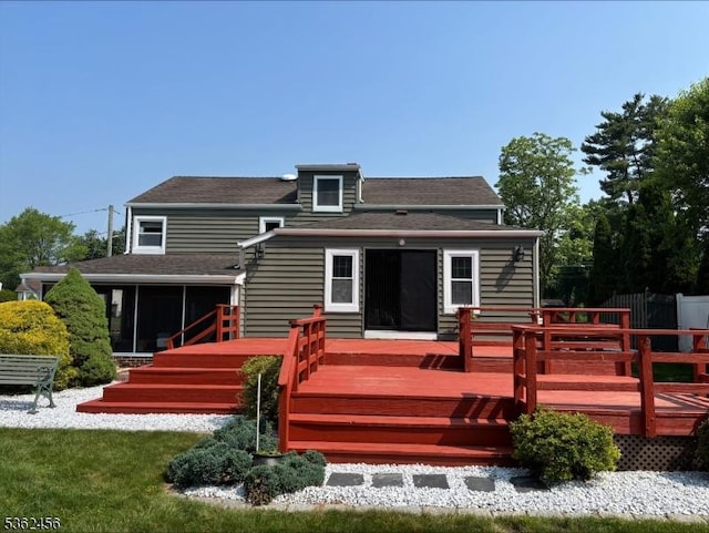 7 Claudia Rd, Hillsborough Twp, NJ 08844 - back of property featuring a sunroom, a deck, and a shingled roof