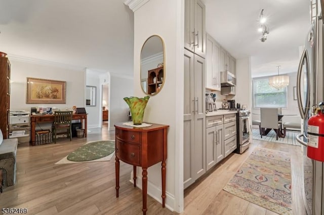 530 Valley Rd Unit 2D, Montclair Twp, NJ 07043 - corridor featuring crown molding, light wood-style floors, and a chandelier