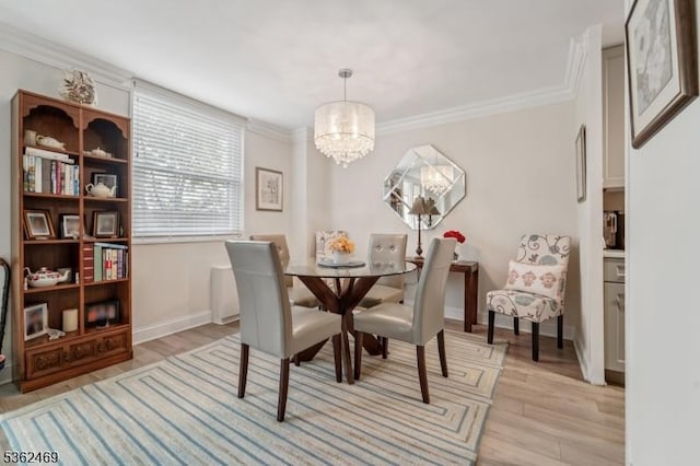 530 Valley Rd Unit 2D, Montclair Twp, NJ 07043 - dining room featuring a chandelier, light wood-style floors, and ornamental molding