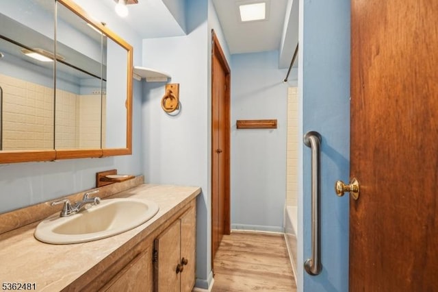 26 Bay View Rd, Hopatcong Boro, NJ 07843 - full bathroom with vanity, wood finished floors, and bathing tub / shower combination