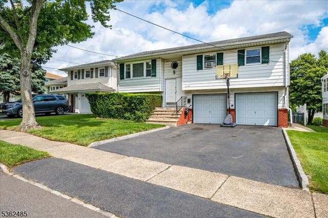 2145 Keller Crk, Union Twp, NJ 07083 - bi-level home featuring driveway, an attached garage, a front lawn, and brick siding