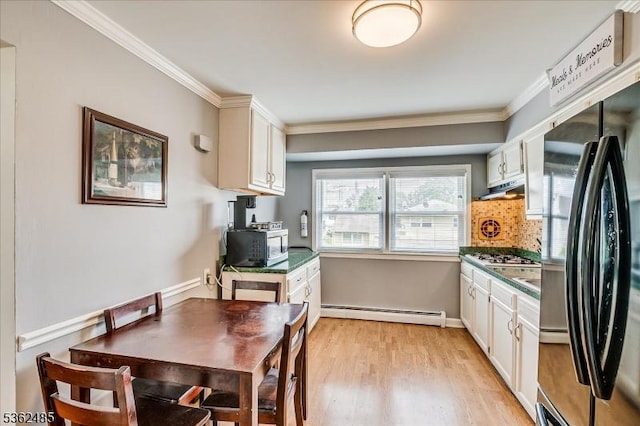 2145 Keller Crk, Union Twp, NJ 07083 - kitchen with freestanding refrigerator, a baseboard heating unit, ornamental molding, white cabinets, and light wood-style flooring
