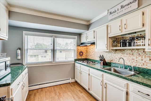 2145 Keller Crk, Union Twp, NJ 07083 - kitchen featuring a baseboard radiator, a sink, crown molding, dark countertops, and white cabinets