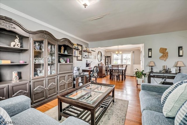 2145 Keller Crk, Union Twp, NJ 07083 - living area featuring a chandelier, ornamental molding, and light wood-type flooring