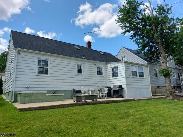 1247 Highland Ave, Union Twp, NJ 07083 - rear view of house featuring a yard, a patio area, and a chimney