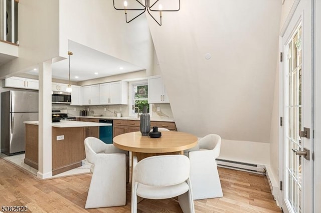 51 Scenic Dr, Green Twp, NJ 07821 - dining area with baseboard heating, light wood-style floors, a towering ceiling, a chandelier, and recessed lighting