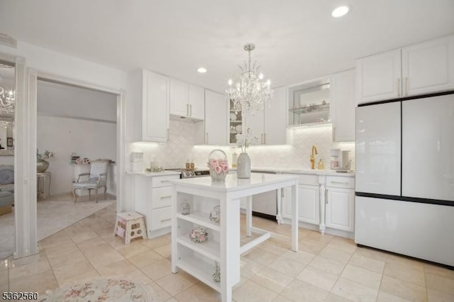 59 Guy St, Dover Town, NJ 07801 - kitchen with freestanding refrigerator, open shelves, dishwasher, light countertops, and recessed lighting