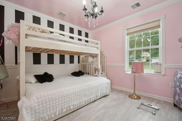 59 Guy St, Dover Town, NJ 07801 - bedroom with wood finished floors, ornamental molding, a chandelier, and baseboards