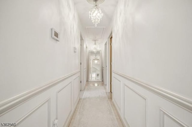 59 Guy St, Dover Town, NJ 07801 - hallway with a decorative wall, wainscoting, light tile patterned floors, and attic access