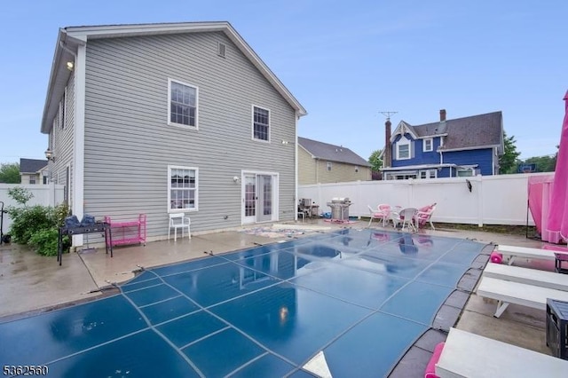 59 Guy St, Dover Town, NJ 07801 - view of swimming pool with a fenced backyard, a patio, and french doors