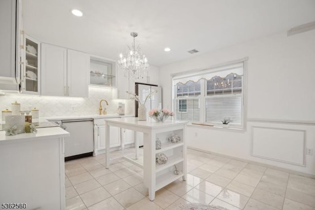 59 Guy St, Dover Town, NJ 07801 - kitchen with open shelves, light countertops, white cabinetry, a sink, and a chandelier