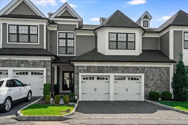 302 Tiffany Way Unit 302, Watchung Boro, NJ 07069 - view of front facade featuring stone siding, driveway, a garage, and a shingled roof