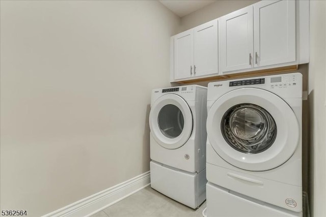 302 Tiffany Way Unit 302, Watchung Boro, NJ 07069 - laundry area with independent washer and dryer, cabinet space, and light tile patterned floors