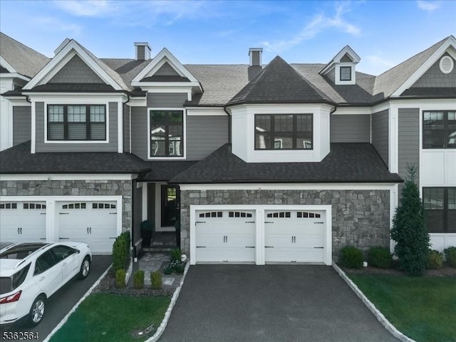 302 Tiffany Way Unit 302, Watchung Boro, NJ 07069 - view of front of house with driveway, stone siding, and an attached garage