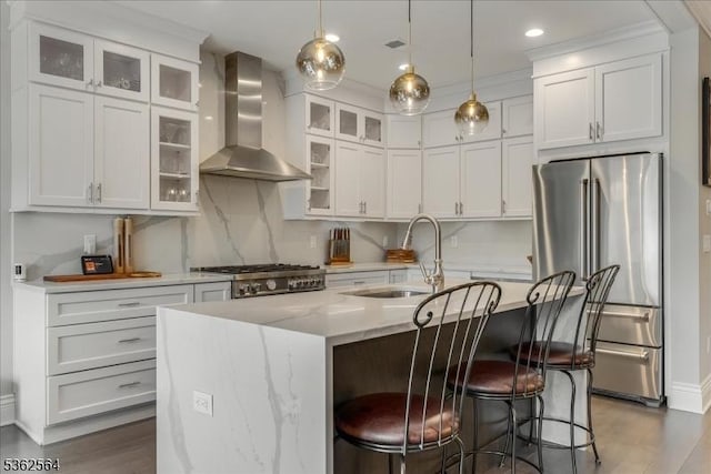 302 Tiffany Way Unit 302, Watchung Boro, NJ 07069 - kitchen with wall chimney exhaust hood, high quality fridge, wood finished floors, a breakfast bar area, and white cabinetry