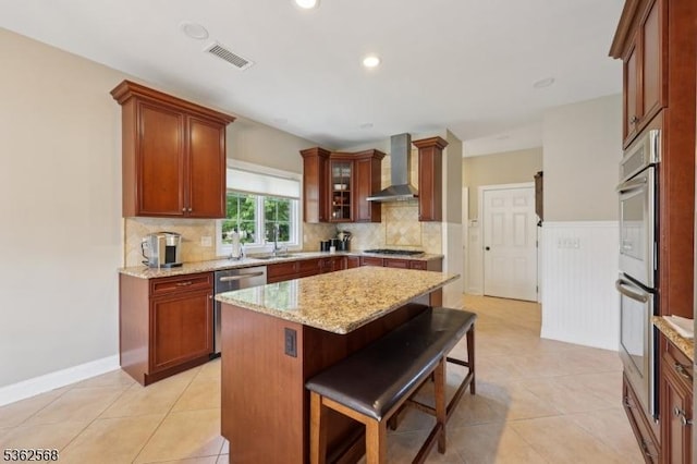 202 Old Sand Rd, Fairfield Twp, NJ 07004 - kitchen featuring wall chimney range hood, appliances with stainless steel finishes, tasteful backsplash, light stone counters, and recessed lighting