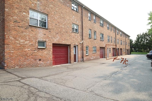 67-75 New England Ave Unit 71C, Summit City, NJ 07901 - view of building exterior featuring an attached garage