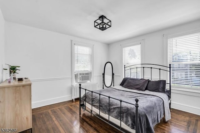 142 Westervelt Ave, North Plainfield Boro, NJ 07060 - bedroom featuring radiator heating unit, multiple windows, wood finished floors, and cooling unit