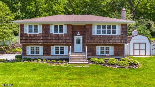 1 Hemlock Dr, Franklin Boro, NJ 07416 - bi-level home with a front lawn and roof with shingles