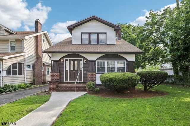 220 Vassar Ave, Newark City, NJ 07112 - bungalow-style house with a front lawn, roof with shingles, and entry steps