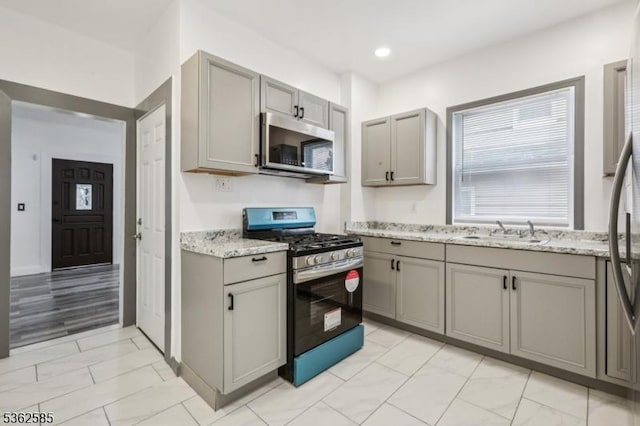 220 Vassar Ave, Newark City, NJ 07112 - kitchen featuring stainless steel appliances, gray cabinetry, light marble finish flooring, a sink, and recessed lighting