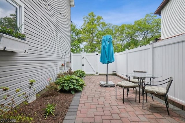 547 Logan Dr, Roxbury Twp, NJ 07850 - fenced backyard with a gate, a patio area, and outdoor dining area