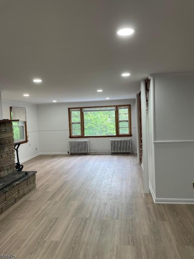 297 Terhune Dr, Wayne Twp, NJ 07470 - unfurnished living room featuring radiator, wood finished floors, and recessed lighting