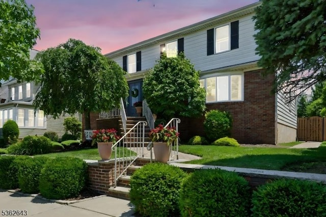 80 Rose St, Wood-Ridge Boro, NJ 07075 - view of front of home featuring stairs, brick siding, and a front yard