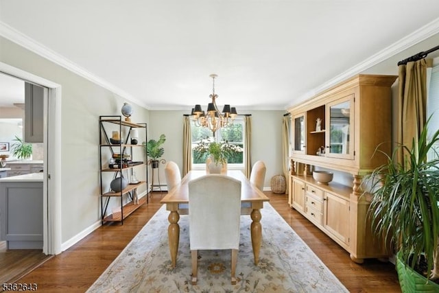 80 Rose St, Wood-Ridge Boro, NJ 07075 - dining space with a chandelier, ornamental molding, dark wood-style flooring, and a baseboard radiator
