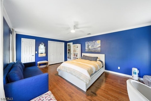 80 Rose St, Wood-Ridge Boro, NJ 07075 - bedroom with two closets, ornamental molding, wood finished floors, and a ceiling fan