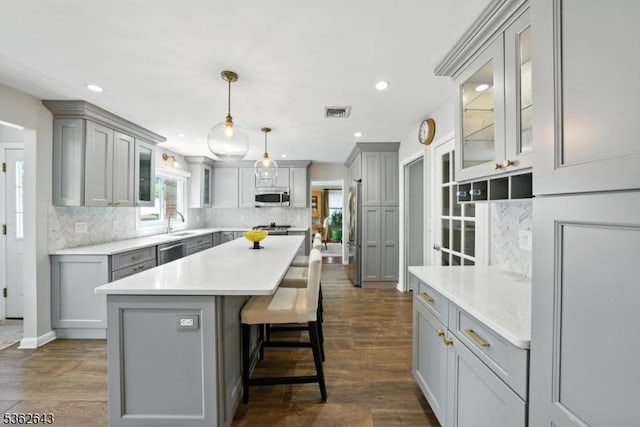 80 Rose St, Wood-Ridge Boro, NJ 07075 - kitchen featuring gray cabinets, stainless steel appliances, decorative backsplash, a center island, and recessed lighting
