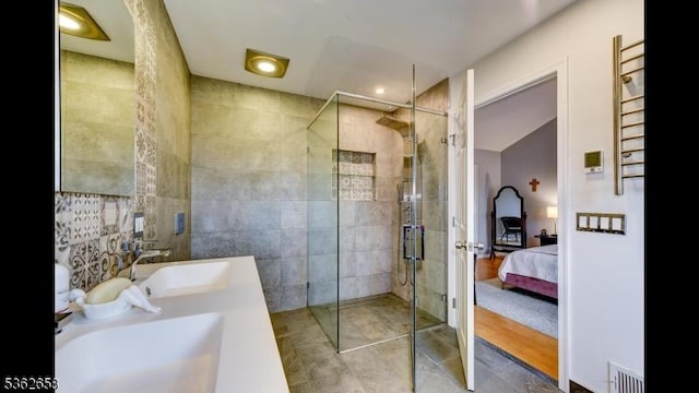 8 Clark Ct, Bernards Twp, NJ 07920 - ensuite bathroom with a stall shower, double vanity, and tile walls