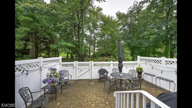8 Clark Ct, Bernards Twp, NJ 07920 - view of patio / terrace with outdoor dining area and view of scattered trees