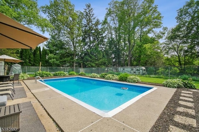 22 Corwin St, Randolph Twp, NJ 07869 - view of pool featuring a patio, view of scattered trees, and a fenced backyard
