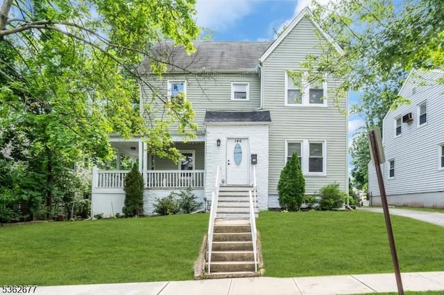 146 Williamson Ave, Hillside Twp, NJ 07205 - view of front of home featuring a front lawn, a shingled roof, and covered porch
