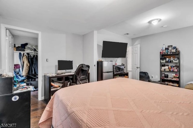 146 Williamson Ave, Hillside Twp, NJ 07205 - bedroom with freestanding refrigerator, wood finished floors, a walk in closet, a closet, and an office area