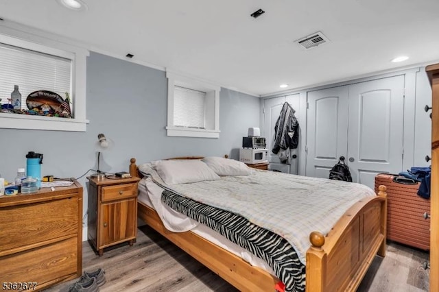 146 Williamson Ave, Hillside Twp, NJ 07205 - bedroom featuring light wood-style flooring, a closet, and recessed lighting