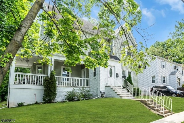 146 Williamson Ave, Hillside Twp, NJ 07205 - view of front facade with covered porch and a front lawn