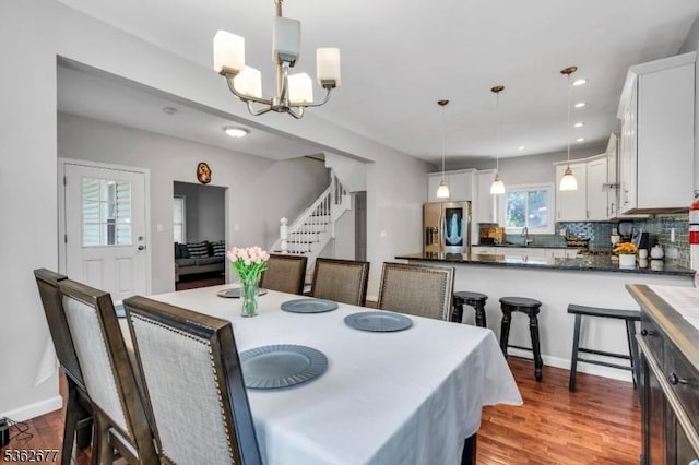 146 Williamson Ave, Hillside Twp, NJ 07205 - dining area featuring stairway, a chandelier, wood finished floors, recessed lighting, and baseboards