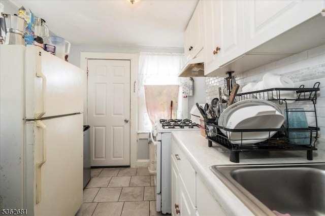 141 Berckman St, Plainfield City, NJ 07062 - kitchen featuring white appliances, light countertops, white cabinetry, and light tile patterned flooring