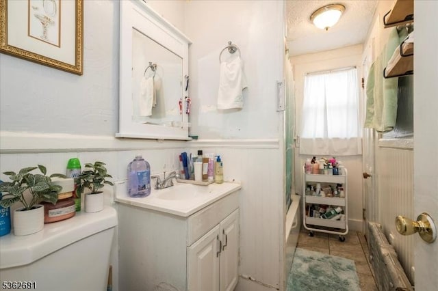 141 Berckman St, Plainfield City, NJ 07062 - full bathroom featuring toilet, vanity, wainscoting, radiator, and bathtub / shower combination
