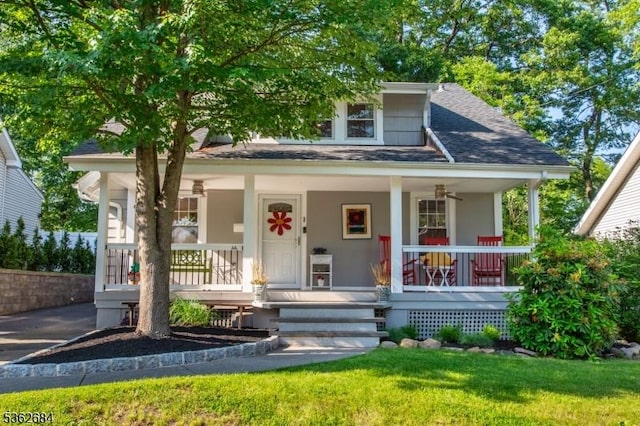 44 Lincoln Ave, Livingston Twp, NJ 07039 - view of front of home with covered porch, a shingled roof, a front lawn, and stucco siding