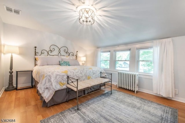 44 Lincoln Ave, Livingston Twp, NJ 07039 - bedroom with radiator heating unit, vaulted ceiling, wood finished floors, and baseboards