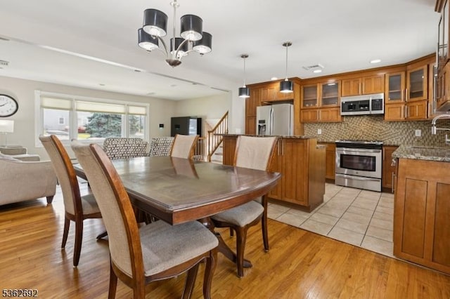 1589 Julian Ter, Union Twp, NJ 07083 - dining room with a chandelier, light wood-style flooring, stairs, and recessed lighting
