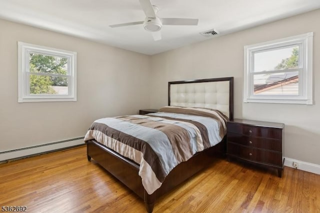 1589 Julian Ter, Union Twp, NJ 07083 - bedroom featuring baseboard heating, light wood finished floors, and ceiling fan