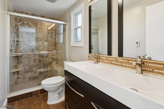 1589 Julian Ter, Union Twp, NJ 07083 - bathroom with double vanity, tasteful backsplash, a stall shower, and wood finished floors